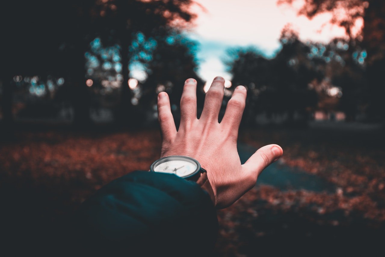person-wearing-round-analog-watch-986831